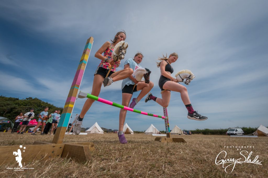 Three girls jumping at HHA Camp 2026
